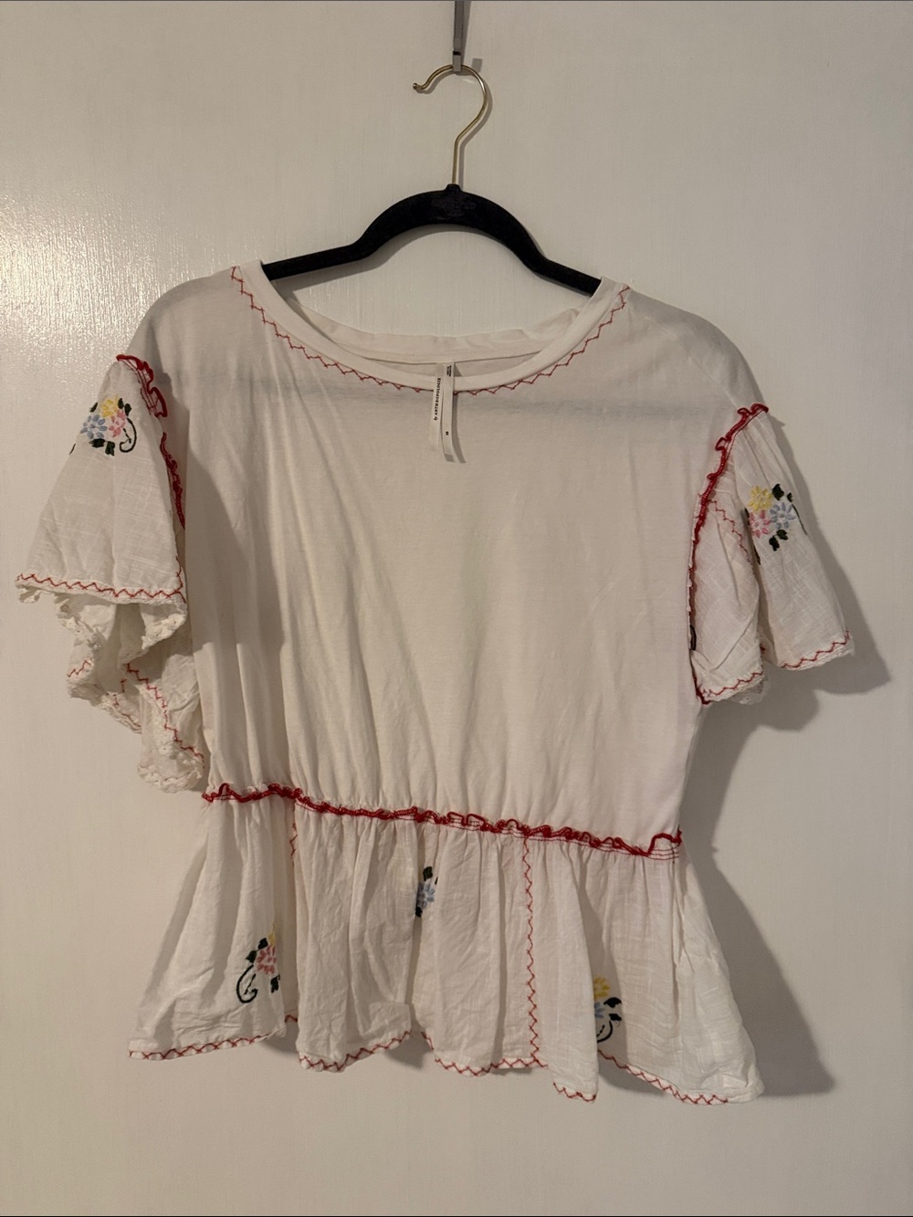 Anthropologie White Peplum Blouse with Red Trim and Floral Embroidery